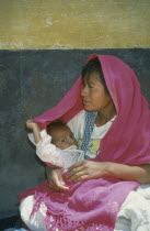 Mexican Indian mother and child on side street off Plaza Principal.