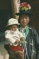 Tu minority Yellow Hat Buddhist mother and daughter.