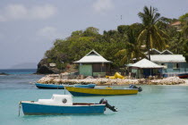 Fishing boats and beachside houses in Britannia Bay