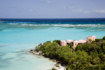 Pink villa on the headland of Carenage bay at Raffles Resort