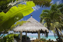 Palapa thatched entrance from hotel jetty at Tamarind Beach Hotel in Charles Bay