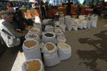 Sacks of lentils pulses rice and wheat at the fresh produce marketAgricultural produce available products