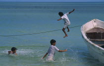 Gulf of Mexico.  Children jumping from fishing boat into the sea.play