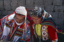 Bride and groom during wedding ceremony encircled together with length of wool.