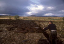 Peat cutter at workEire Republic turf fuel
