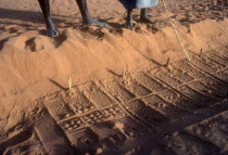 Divination marks left on patterns in sand by desert fox which the Dogon use to answer questions about the future