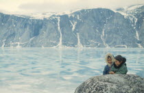 Inuit children in glacial landscape.Formally part of the Northwest Territories