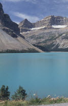 View over mountain lake toward rocky cliffsCenter Centre