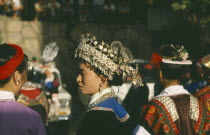 Miao girl in traditional silver head-dress.