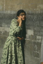 Temple of Heaven.Woman standing next to wall