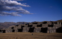 15th Century Inca fortress ruins built from enormous bolders with nearby tourists