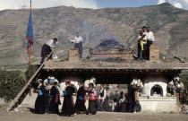 Burning Juniper and other offerings at a Temple entrance during a Tibetan festival