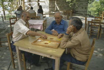 Men Playing Backgammon outydoors