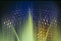 Walt Disney World Epcot Center Spaceship Earth illuminated at night through fountain. **Editorial Use Only**