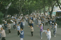 Group of people taking part in Tai Chi exercise
