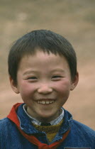 Portrait of smiling young boy. Member of the Young Pioneers.