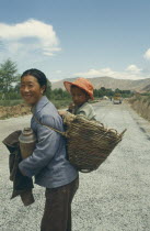 Mother with Child in Basket