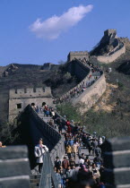 View along The Great Wall leading up and over hills with people walking