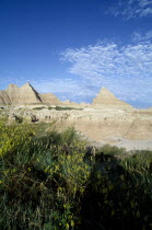 View over landscape toward pyramid shaped rock formations