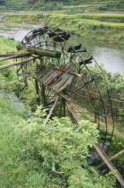 Bamboo Water Wheel collecting water from river.