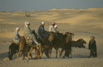 Men riding Camels
