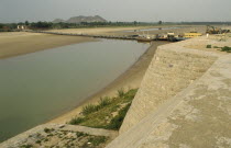 View over river and dykes after upstream irrigation leaving only shallow water.