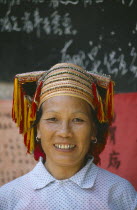 Dong lady  with gold teeth wearing traditional head-dress