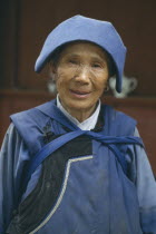 Naxi lady in traditional blue clothes