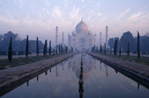 The Taj Mahal seen over misty pool at dawn
