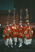 Four young boys in costume with elaborate head-dresses at the Autumn Festival in the temple grounds