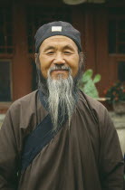 Head and shoulders portrait of Taoist / Daoist priest
