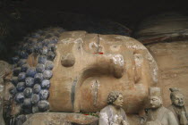 Tang Dynasty reclining sleeping Buddha depicting the state of achieving nirvana carved into the cliff at Dazu 102 feet long and 16 feet high built between 1179 and 1249