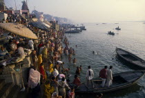 Crowded banks of the Ganges River during festival
