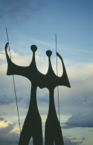 Os Candangos  or The Warriors  sculpture by Bruno Giorgi silhouetted at dusk.