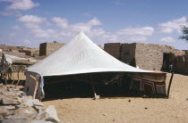 Tent pitched near old buildings