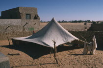 Tent pitched near old buildings