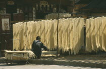 Noodles hanging up to dry.