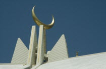 Faisal Mosque roof detail of golden crescent moon.