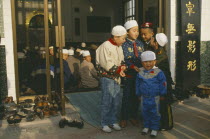 Group of muslim boys outside mosque.