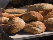 Different shaped bread on sale at a market stall in the town of Rouille.