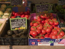 Tomatoes and Avocados on sale at the market in the town of Rouille.