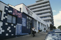 Street scene with internet cafe beside beauty salon.