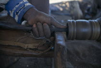 Kadzuwa Crafts.  Cropped view of craftsman using wood turner to produce fair trade carved items for export.