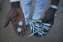 Micro-credit loan.  Cropped shot of Peter Makfero Hamilton who travels to Lake Malawi to buy fish to resell in business started using money lent by his village credit union.