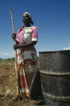 Female worker on LOMADEF Lipangwe Organic Manure Demonstration Farm using chicken manure on land. Good crop yields are achieved without expensive fertilisers.