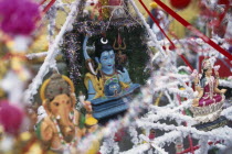 Pilgrimage kanwar containing figures of the Hindu gods decorated with coloured streamers and tinsel carried to the Grand Bassin lake during the Maha Shivaratree festivalCelebration in honour of Hindu god Siva Colored