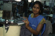 Freezone.  Young woman working in textile factory.