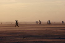 People moving across desert landscape.Sahrawi Arab Democratic Republic Morocco disputed area