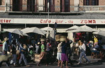 Zoma Market.  Busy market scene with cafe bar  roadside stalls and people carrying baskets on their heads.Tana