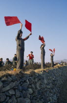 Juche people waving red flags cheering leaders repairing flood damaged dykes.Juche  pronounced /t.ut..e/ in Korean  approximately "joo-cheh"  is the official ideology of North Korea  and informally t...